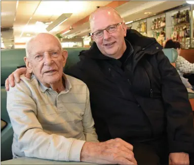  ?? TANIA BARRICKLO- DAILY FREEMAN ?? Salvatore Philip Mattracion, left, who was to turn 101 today, sits with his grandson, Ellenville Police Chief Philip S. Mattracion, who he helped raise after the younger Mattracion’s father was killed in Vietnam.