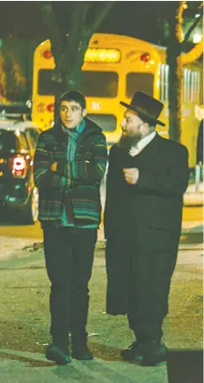  ?? PHOTOS: IFC MIDNIGHT ?? Actors Dave Davis, left, and Menashe Lustig star in The Vigil, a movie that fails to live up to its intriguing setup.
