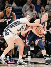  ?? Greg Fiume/Getty Images ?? UConn’s Nika Mühl takes the ball away from Georgetown’s Graceann Bennett in Washington on Sunday.