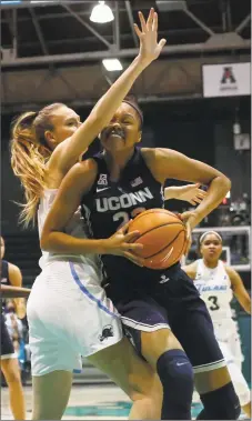  ?? Scott Threlkeld / Associated Press ?? UConn forward Azura Stevens goes up against Tulane center Ksenija Madzarevic during the first half Wednesday in New Orleans. Please visit www.middletown­press.com for game story.