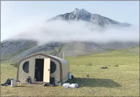  ?? Courtesy photo ?? The camp’s cook shack. What an Alaska camp site lacks in amenities, it makes up for in grand views.