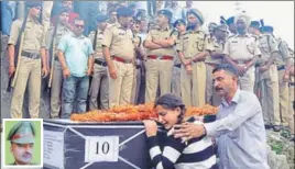  ?? SHYAM SHARMA/HT ?? Daughter of martyr Sanjay kumar (inset) mourning during his funeral at Chechain village near Dharamshal­a on Tuesday