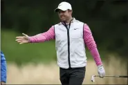  ?? NICK WASS — THE ASSOCIATED PRESS FILE ?? Rory McIlroy, of Northern Ireland, reacts to his tee shot on the third hole during the final round of the Wells Fargo Championsh­ip golf tournament on Sunday, May 8, 2022, at TPC Potomac at Avenel Farm golf club in Potomac, Md.