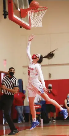  ?? NiCOLAUS CzARnECki / HERALD STAFF ?? CLEAR SAILING: Burlington's Sydney Pavao makes the layup during Saturday’s win over Wilmington. She finished with a team-high 17 points.