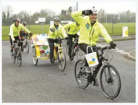  ??  ?? Matt Baker cycles past the Army Aviation Centre at Wallop on the Rickshaw Challenge for Children in Need