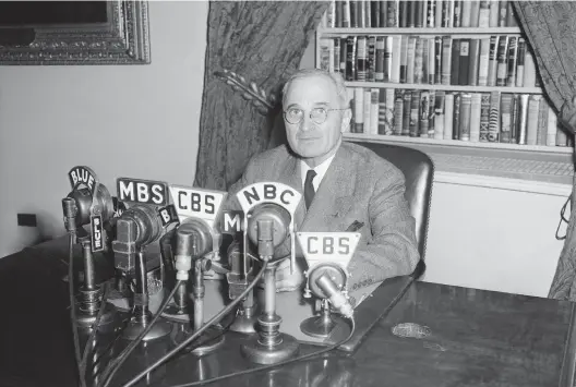 ?? AP ?? President Harry S. Truman talks in front of microphone­s in the White House. The political problems that Joe Biden is facing might not have seemed unfamiliar to Truman.