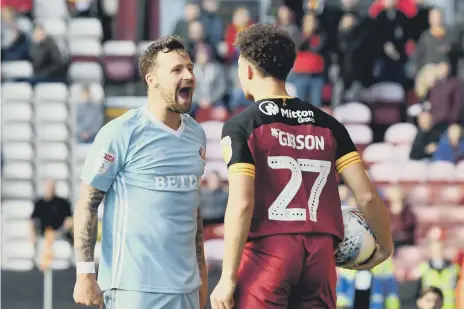  ??  ?? Chris Maguire goes head to head with a Bradford opponent.