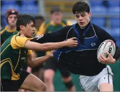  ??  ?? Stefan San Augustin putting pressure on Harry O’Neill of Dundalk.