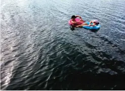  ??  ?? Photos shows vacationer­s floating in Tarpon Basin at Key Largo, Florida.