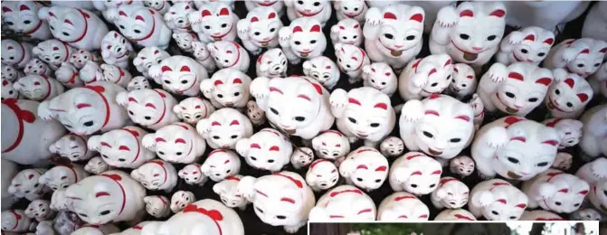  ??  ?? Photo shows cat figurines called “maneki-neko” at the Gotokuji temple in Tokyo. — AFP photos