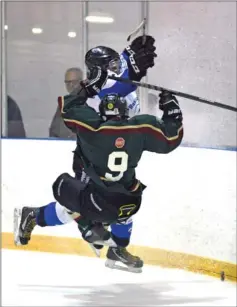  ?? Photo by Steven Mah ?? Hurricanes forward Josh Dickie leveled Regina’s Malik Henry during the second period of Sunday’s series clinching win.