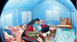  ??  ?? About 5,000 persons displaced by floods and landslides continue to remain in temporary camps. Pix by Amila Gamage and Indika Handuwala