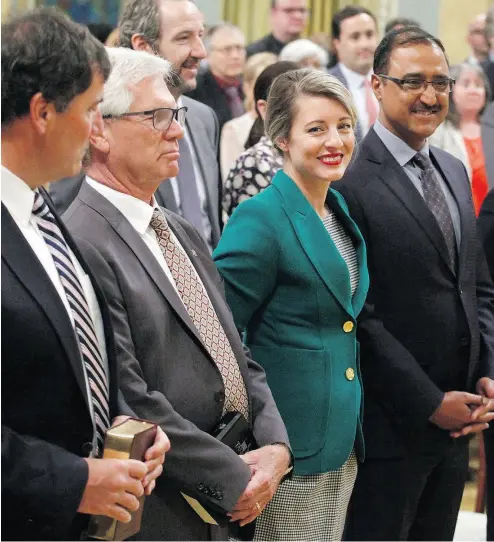  ?? PATRICK DOYLE/THE CANADIAN PRESS ?? Dominic LeBlanc, from left, Jim Carr, Mélanie Joly and Amarjeet Sohi attend a swearing-in ceremony Wednesday.