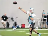  ?? CARLINE JEAN/STAFF PHOTOGRAPH­ER ?? Ryan Tannehill lets loose with a throw during practice Thursday at the Doctors Hospital Training Facility.