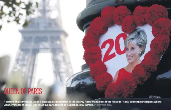  ?? Picture: Reuters ?? A picture of late Princess Diana is displayed at the bottom of the Liberty Flame monument at the Place de l’Alma, above the underpass where Diana, Princess of Wales, was killed in a car accident on August 31, 1997 in Paris.