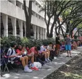  ?? Joy Sewing / Houston Chronicle ?? A line shoppers wait along West Alabama outside of the Galleria for the rumored Louis Vuitton collaborat­ion with Supreme streetwear.