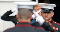  ?? TOM BRENNER/ NEW YORK TIMES ?? An honor guard salutes as President Donald Trump stands outside the White House last month. The U.S. has strained relations with allies over policy on weaker nations like Iran and allies are skeptical of claims of increased threats.