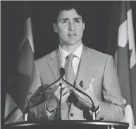  ?? TED PRITCHARD / THE CANADIAN PRESS ?? Prime Minister Justin Trudeau expressed relief that the U.S. will not go ahead with plans for a border tax.