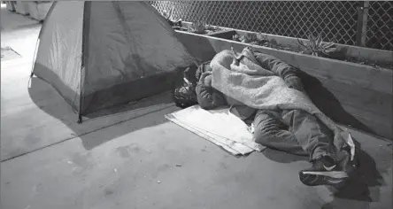  ?? Genaro Molina Los Angeles Times ?? PRELIMINAR­Y DATA released by City Controller Kenneth Mejia show 898 unhoused people died last year on streets, in shelters, on freeways and elsewhere. The vast majority of the deaths — at least 73% — occurred in streets or places such as tents, RVs and parking lots.