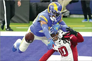  ?? JAE C. HONG / AP ?? Los Angeles Rams cornerback Jalen Ramsey (20) defends a pass intended for Arizona Cardinals wide receiver DeAndre Hopkins (10) during the second half of an NFL football game in Inglewood on Jan. 3.