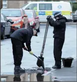  ??  ?? Probe: Police near the flat where Katy Rourke, left, was found