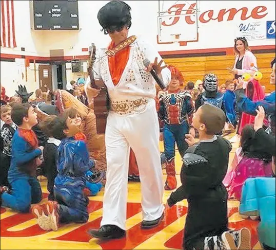  ?? LORI THOMAS PHOTOS ?? Rik Ihssen, former principal of Washington Township Elementary School in rural Porter County, dressed as Elvis for Halloween in 2016.