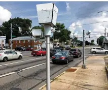  ?? MIKE CAMPBELL / STAFF ?? This red light camera at the corner of Smithville and Patterson roads was one of several installed at Dayton intersecti­ons, dating back to 2003. The city suspended its program last July because police officers must to be present in order to issue fines.