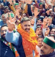  ?? ?? VIKRAMADIT­YA SINGH of the Congress with supporters before filing his nomination papers for Shimla Rural constituen­cy on October 21.