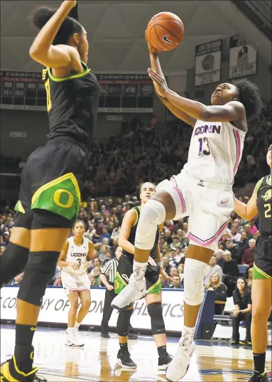  ?? Jessica Hill / Associated Press ?? UConn’s Christyn Williams (13) shoots over Oregon's Satou Sabally, front left, in the first half Monday in Storrs.