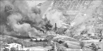  ??  ?? File photo shows first responders work on the site of a train wreck in Lac-Megantic, Quebec. — Reuters photo