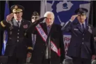  ?? ANDRES KUDACKI — THE ASSOCIATED PRESS ?? Former astronaut Buzz Aldrin, center,salutes during the annual Veterans Day parade in New York, Saturday. Aldrin served as Grand Marshal as he joined Mayor Bill de Blasio and others at the city’s parade.