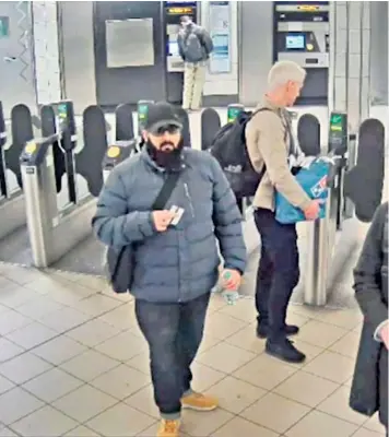  ??  ?? Usman Khan at Bank Undergroun­d station on his way to the conference at Fishmonger­s’ Hall, where he stabbed two people to death