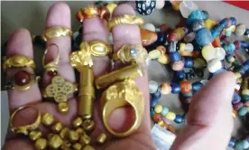  ?? ?? ‘Extraordin­ary stuff’: a handful of gold rings, beads and sandalwood gold coins of Srivijaya, found on the seabed near Palembang. Photograph: Images courtesy of Wreckwatch Magazine