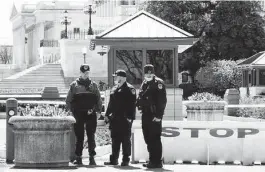  ??  ?? Members of the Capitol Police pay their respects Saturday at the site where Evans was killed.