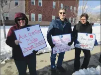  ?? Photo by Joseph B. Nadeau ?? Woonsocket teachers and paraprofes­sionals held an informatio­nal picket on Thursday, this time outside the Hamlet Middle School on Hamlet Avenue, calling attention to their continuing impasse with the city over a new contract. From left are Pauline Cournoyer, a teacher at Globe Park Elementary, Tony Cosentino, a teacher at the high school, and Christine Parker, also a teacher at Globe Park.