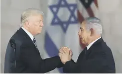  ??  ?? 0 Donald Trump and Benjamin Netanyahu at Yad Vashem