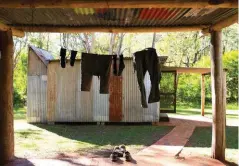  ??  ?? The afternoon sun is needed to dry clothes and shoes at Colwells Hut after the wet-river section through the steep-sided Green Gully valley on Day 3.