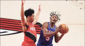  ?? Abbie Parr / TNS ?? The Knicks’ Immanuel Quickley (5) drives against the Trail Blazers’ Anfernee Simons (1) on Sunday.