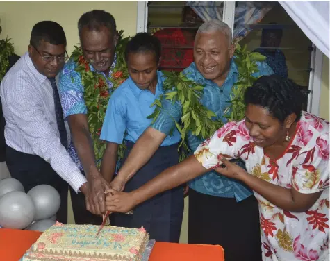  ?? Photo: Waisea Nasokia ?? From left: Minister for Education Mahendra Reddy, Tui Magodro Ratu Simione Navutevute, a student, Prime Minister Voreqe Bainimaram­a and principal Alumita Ciwanacagi at the opening of the Magodro Secondary School in Bukuya, Ba, yesterday.