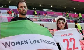  ?? AFP/Getty Images ?? Iran supporters protest during the match against Wales. Photograph: Giuseppe Cacace/