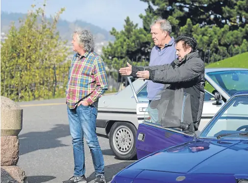  ?? Photograph­s by Sandy McCook ?? GOING HOME: Jeremy Clarkson, Richard Hammond and James May at Inverness Castle.