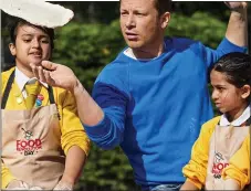  ??  ?? BACKER: Jamie Oliver makes pizza at a London school in 2014