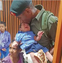  ?? Photo: Nicolette Chambers ?? Private Mateo Kaveni says his goodbyes to his three-month-old son, Jonathan Kaveni and his daughter Serafina Kaveni at Nadi Internatio­nal Airport on March 18, 2019.