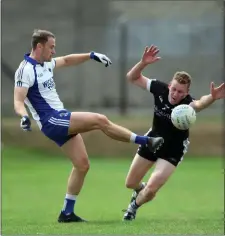  ??  ?? Dean Healy gets his shot away as Mark Fitzsimons closes in.