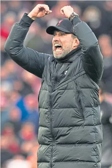  ?? ?? ARMS UP: Manager Jurgen Klopp celebrates with the Anfield crowd at full-time.