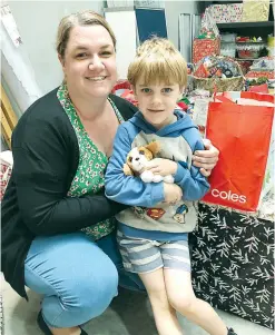  ??  ?? Warragul resident Krista Mountford and her five-year-old son Connor oversee a Reverse Advent Calendar initiative resulting in 400 food hampers for locals in need.