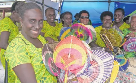  ?? Photo: Ronald Kumar ?? Jacquelyn Takabala (left) with members of the Wesley United Church of Solomon Islands displaying their handicraft­s during the Methodist Church Festival of Praise at Furnival Park in Toorak, Suva, on August 14, 2018.