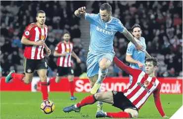  ??  ?? ■ Marko Arnautovic of Stoke City escapes a challenge from Sunderland’s Donald Love.