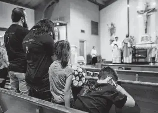  ?? Source: Texas Office of Court Administra­tion
Monte Bach / Staff artist ?? From left, Christian, Giovana, Zoe and Kristian Ornelas attend a Mass in memory of Christian’s sister, Karla Ornelas. She had dreamed of becoming a paralegal to give her son a stable home.