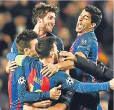  ??  ?? Barcelona players celebrate their 6-5 aggregate victory over Paris Saint-Germain at the Nou Camp.